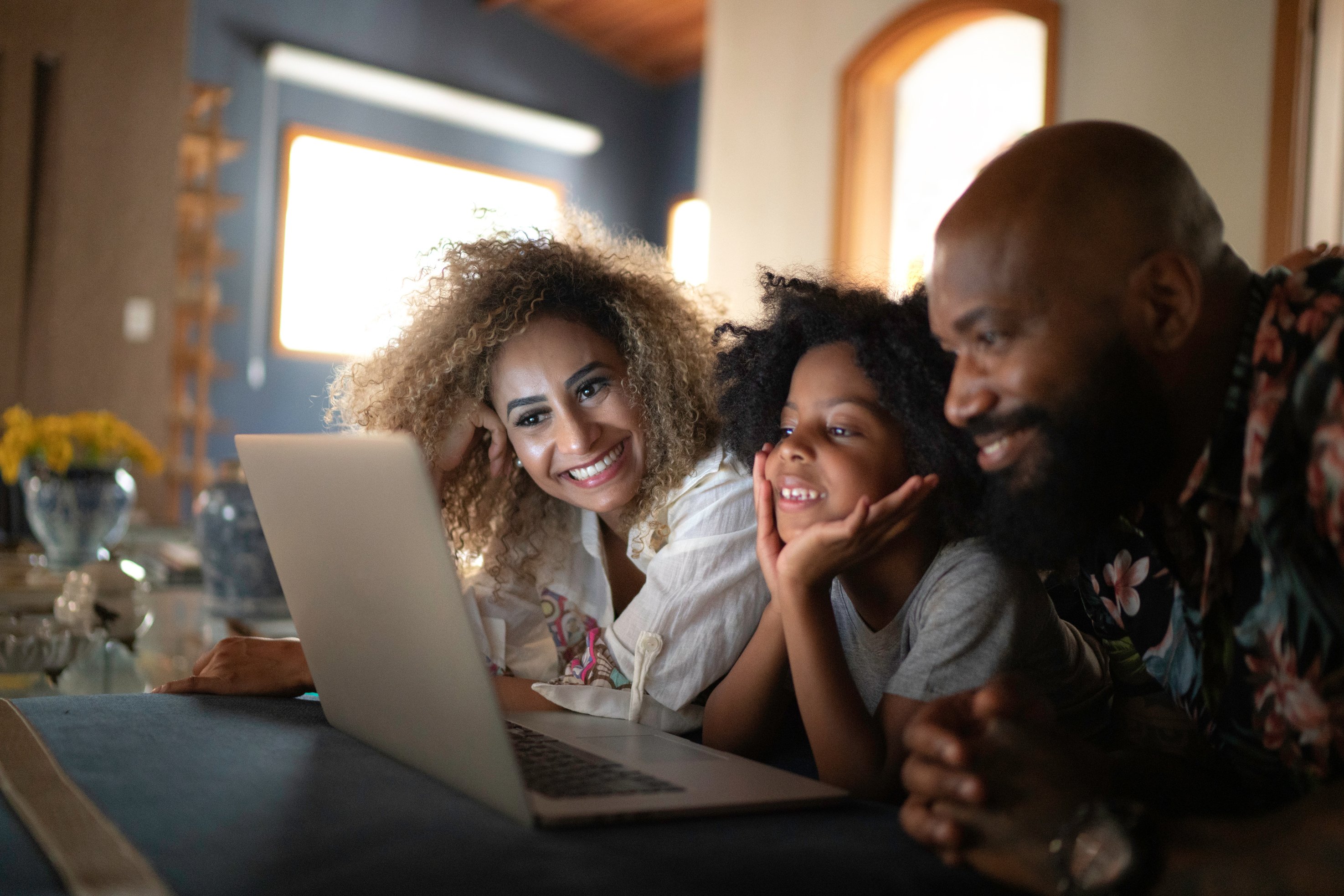 Family watching movie on laptop